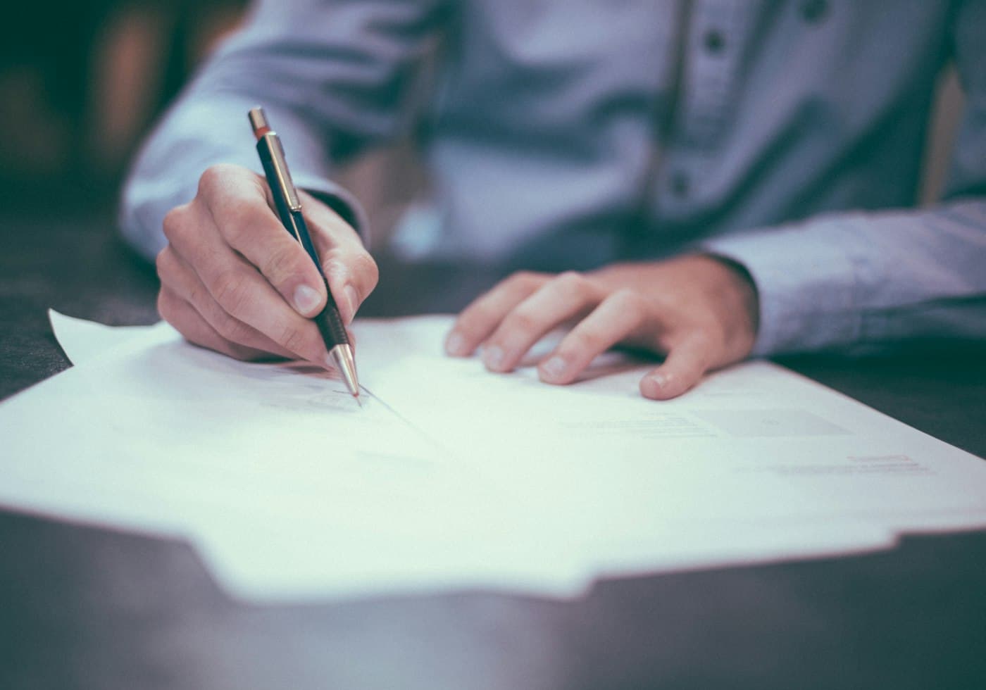 A person signing investment documentation